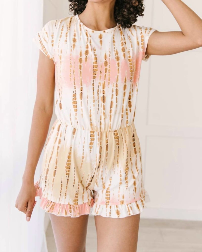 Front of a model wearing a size Large Bamboo Tie Dye Romper in Peach in Peach by Celeste. | dia_product_style_image_id:339123